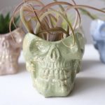 green skull planter with gold fleck