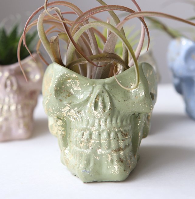 green skull planter with gold fleck