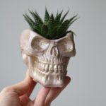 Pink skull planter with gold flecks